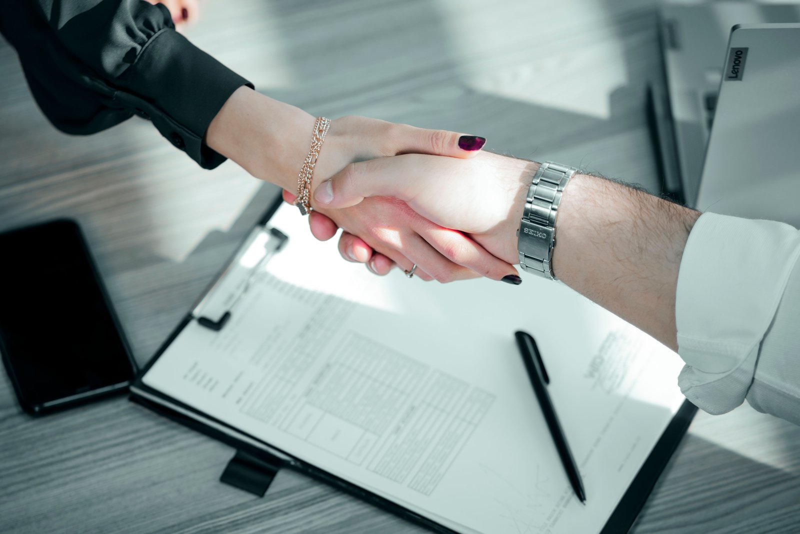 Business handshake over a contract